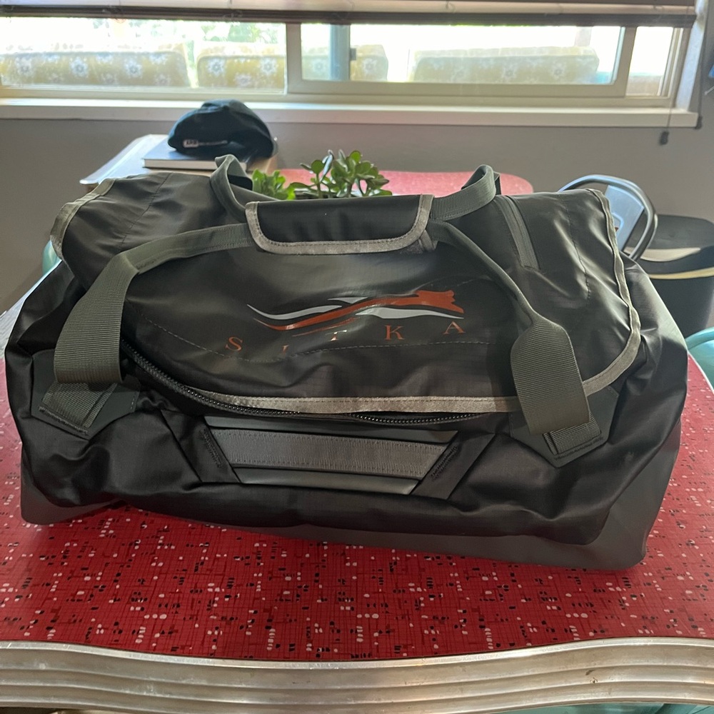 Brand new with tag Sitka waterproof 50l duffle. Black.